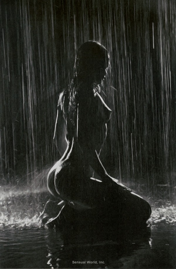 Woman being woman in the rain nude shower